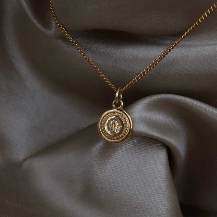 CHRISTIAN DIOR 金色圓牌logo項鏈｜1990年代 - Vintasy